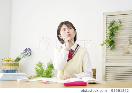 High school student who worries while studying at home High school student who worries while studying at home 95661222