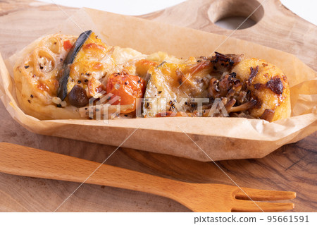Focaccia on a wooden plate Focaccia on a wooden plate 95661591