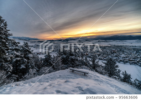 Cold snowy winter morning. Beautiful sunrise over village Liskova in Slovakia Cold snowy winter morning. Beautiful sunrise over village Liskova in Slovakia 95663606