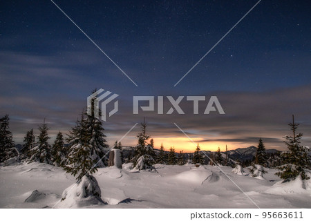 Winter mountain landscape. Snowy trees under sky at night in Smrekovica, Slovakia Winter mountain landscape. Snowy trees under sky at night in Smrekovica, Slovakia 95663611