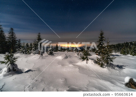 Winter mountain landscape. Snowy trees under sky at night in Smrekovica, Slovakia Winter mountain landscape. Snowy trees under sky at night in Smrekovica, Slovakia 95663614