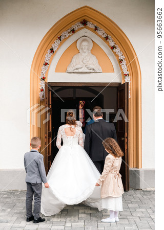 bride and groom waiting outside the church for the wedding ceremony bride and groom waiting outside the church for the wedding ceremony 95663662