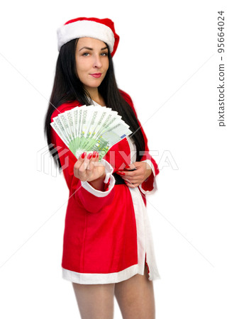 Girl in Santa costume with euros in hand Girl in Santa costume with euros in hand 95664024