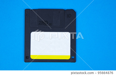 obsolete computer floppy disks on a colored background, isolated, a template for an inscription obsolete computer floppy disks on a colored background, isolated, a template for an inscription 95664876