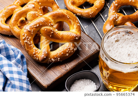 Freshly baked homemade pretzels and beer 95665374
