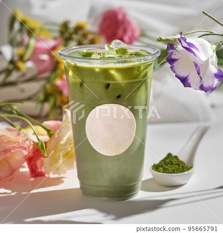 Iced Matcha Green Tea Latte. Smooth and creamy matcha sweetened just right and served with milk over ice. 95665791