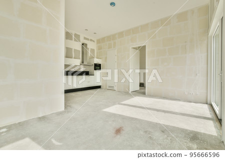 Interior of empty white kitchen with windows and wooden parquet floor Interior of empty white kitchen with windows and wooden parquet floor 95666596