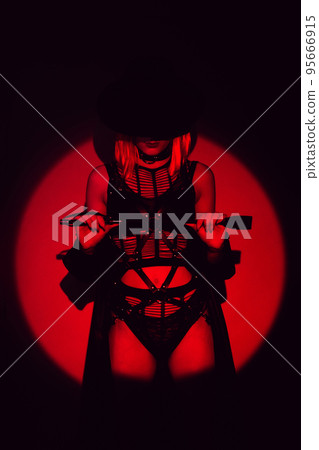 sexy girl with a leather whip in underwear and hat. BDSM concept of dominant woman 95666915
