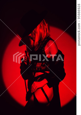 sexy girl with a leather whip in underwear and hat. BDSM concept of a dominant woman 95666928