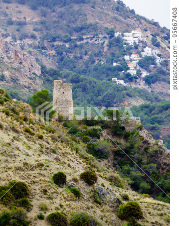 Tower on rocky coast, seaside cliffs, Spain 95667408