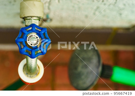 Garden tap with hosepipe attached. 95667419