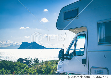 Caravan on spanish coast, Gibraltar rock on horizon 95667457