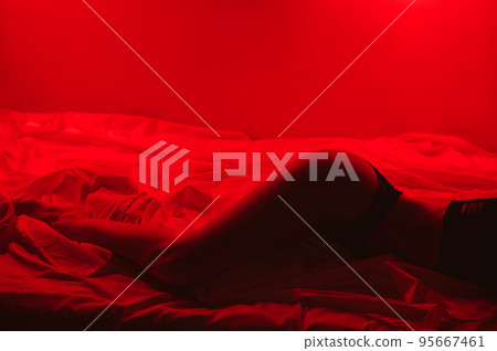 slender girl with a sexy body in beautiful underwear erotically lies on the bed 95667461