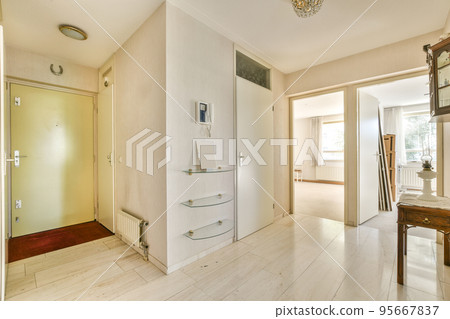 Perspective view of hallway with white walls and parquet floor in minimalist style apartment 95667837