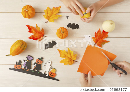 Parent and child or family preparing for Halloween Halloween 95668177