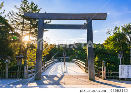 Ise Jingu Inner Shrine Uji Bridge Torii illuminated by the morning sun 95668183