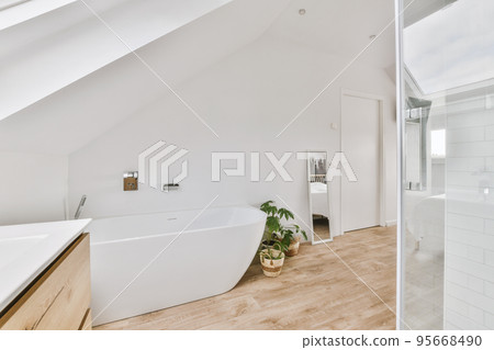 Comfortable bed placed near green wall in modern style mansard bedroom with windows and shower Comfortable bed placed near green wall in modern style mansard bedroom with windows and shower 95668490