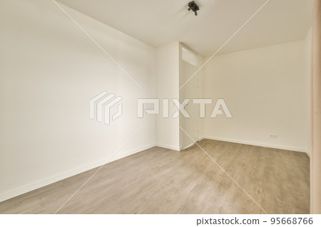 Interior of empty modern apartment with white walls and parquet floor illuminated with lamp Interior of empty modern apartment with white walls and parquet floor illuminated with lamp 95668766