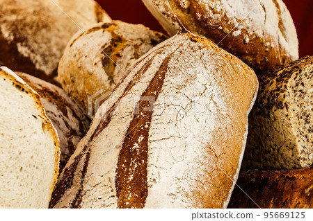 Many rustic fresh bread loaves 95669125