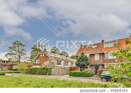 View of street near building with beauty of vegetation outside View of street near building with beauty of vegetation outside 95669165