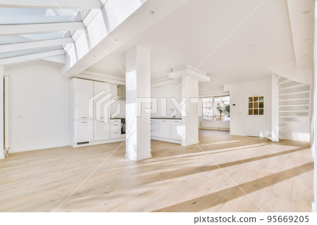 Interior of empty white kitchen with windows and wooden parquet floor Interior of empty white kitchen with windows and wooden parquet floor 95669205