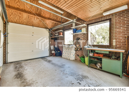 Storage room with pipes and metering devices. A long room with engineering communications in the modern apartment 95669341