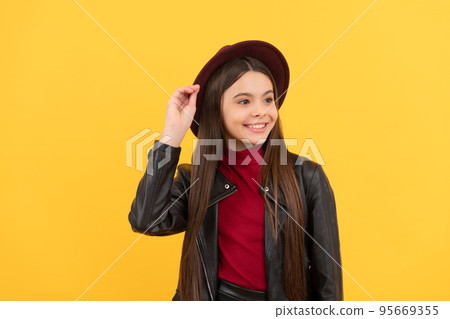 happy teen girl in hat and leather jacket, style 95669355