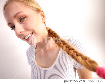 Blonde girl with braid hair Blonde girl with braid hair 95669438