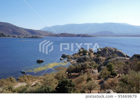 Lake castle with ancient fortifications in Kapikiri village on Bafa lake in Mugla, Turkey Lake castle with ancient fortifications in Kapikiri village on Bafa lake in Mugla, Turkey 95669679