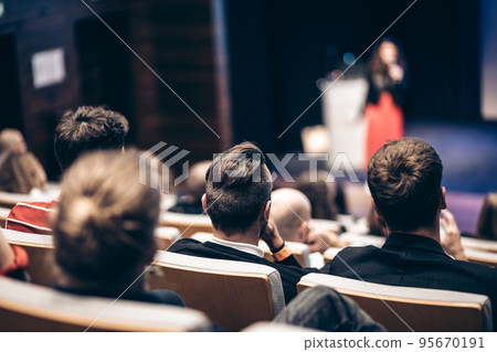 Woman giving presentation on business conference event. Woman giving presentation on business conference event. 95670191