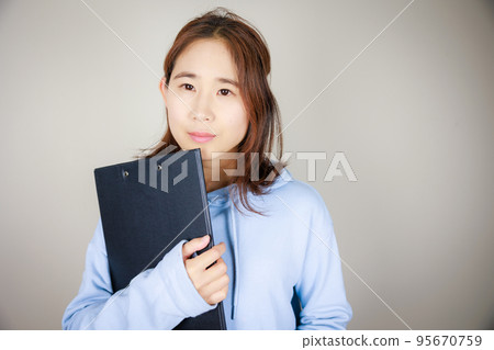 woman with file binder woman with file binder 95670759