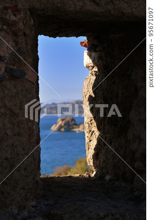 Island with ancient fortifications in Kapikiri village on Bafa lake in Mugla, Turkey Island with ancient fortifications in Kapikiri village on Bafa lake in Mugla, Turkey 95671097