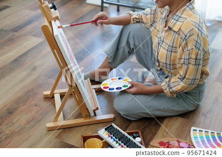 Portrait of an Asian woman designing art in her spare time Portrait of an Asian woman designing art in her spare time 95671424