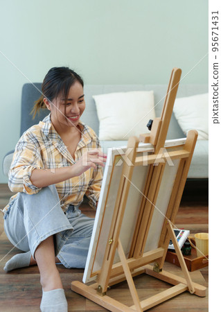 Portrait of an Asian woman designing art in her spare time Portrait of an Asian woman designing art in her spare time 95671431