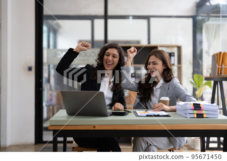 Business colleagues celebrating successful for financial accounting concept. Business colleagues celebrating successful for financial accounting concept. 95671450