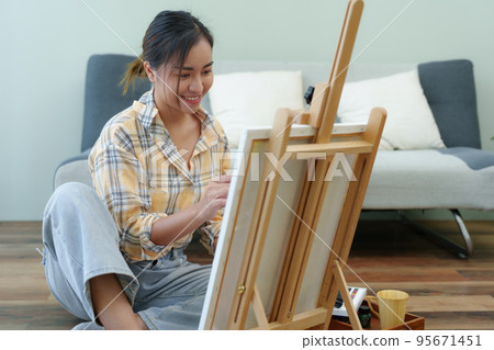 Portrait of an Asian woman designing art in her spare time 95671451