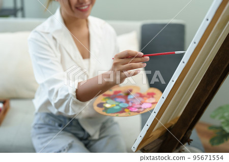 Portrait of an Asian woman designing art in her spare time 95671554