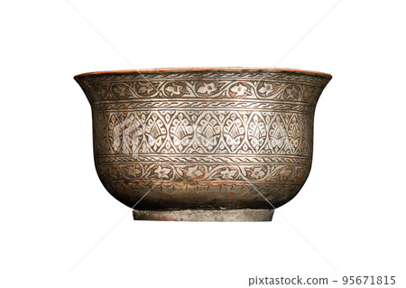 An antique metal bowl with artistic chasing and engraving on a white background An antique metal bowl with artistic chasing and engraving on a white background 95671815