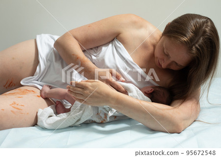 Woman with new born baby have a rest 95672548