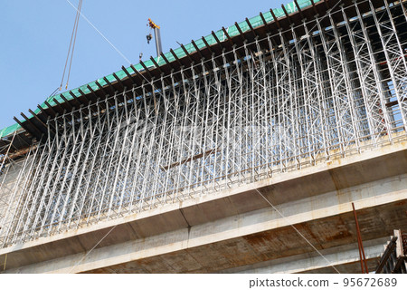 Falsework work at the construction site. It consists of temporary structures used in construction to support a permanent structure until its construction is sufficiently advanced to support itself. 95672689