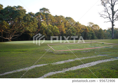 View of Golf Course with beautiful putting green. Golf course with a rich green turf beautiful scenery. View of Golf Course with beautiful putting green. Golf course with a rich green turf beautiful scenery. 95672906