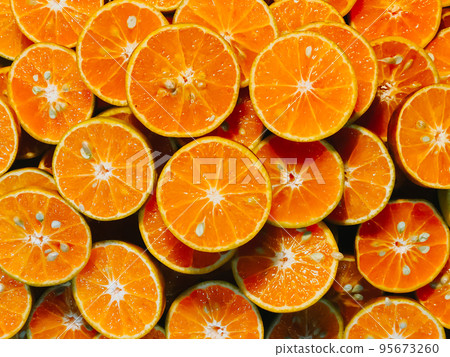 Fresh chopped orange slices food background, Fresh orange color for use in making the background, Orange Slices for sale at the market, orange cut pieces juicy delicious and healthy fruit drink. Fresh chopped orange slices food background, Fresh orange color for use in making the background, Orange Slices for sale at the market, orange cut pieces juicy delicious and healthy fruit drink. 95673260