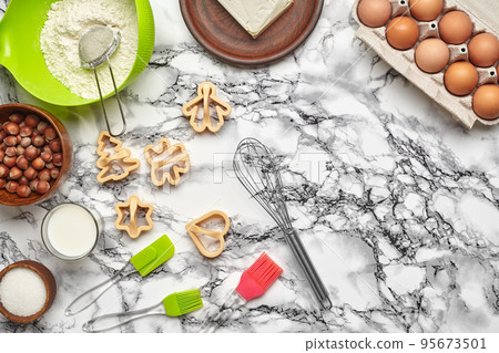 Close-up shot. Top view of a baking ingredients and kitchenware on the marble table background. 95673501