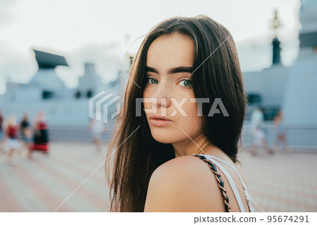 Portrait of brunette girl with blue eyes Portrait of brunette girl with blue eyes 95674291