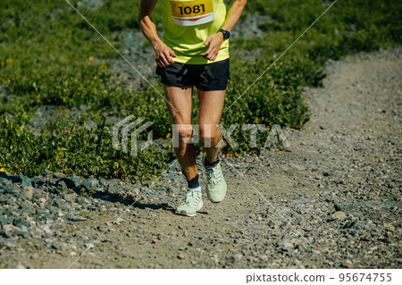 male athletes running uphill race 95674755