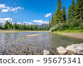 A beautiful photo of river in Canmore, Alberta with the rocky mountains in the background.  95675341