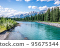 A beautiful photo of river in Canmore, Alberta with the rocky mountains in the background.  95675344