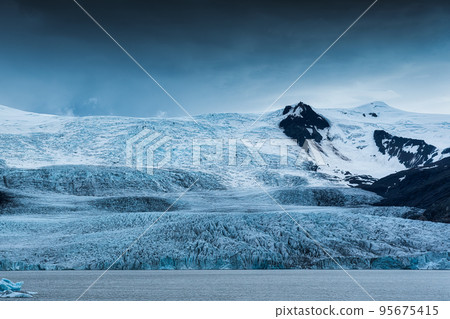 Large natural glacier and moody weather on summer in Iceland 95675415