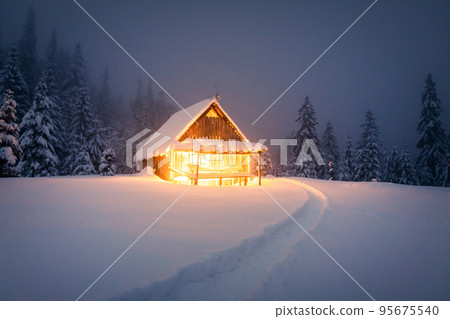 Fantastic landscape with snowy house 95675540