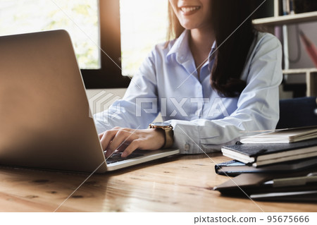 freelance concept,female using computers to design work as ordered by customers freelance concept,female using computers to design work as ordered by customers 95675666